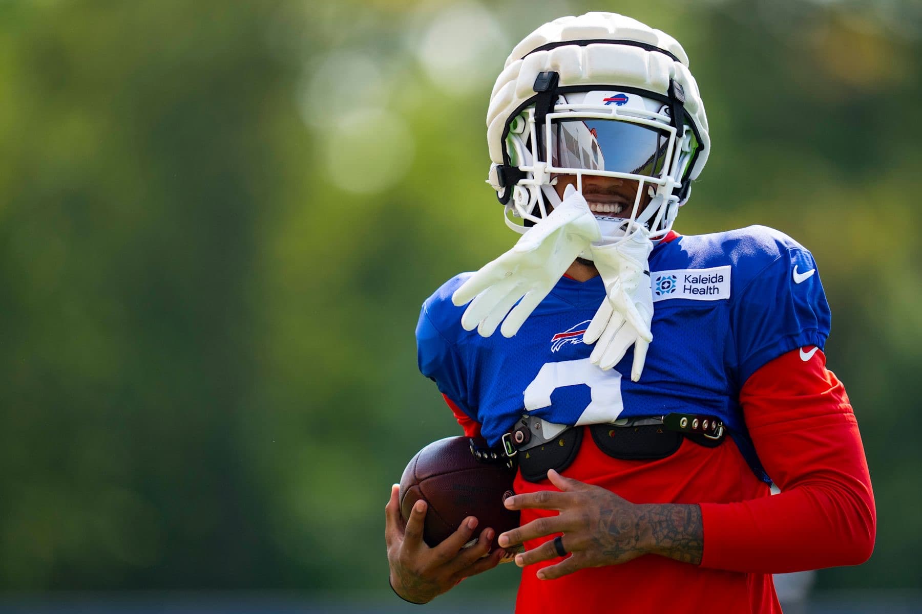 DJ Moore holding a football at Buffalo Bills training camp in 2026
