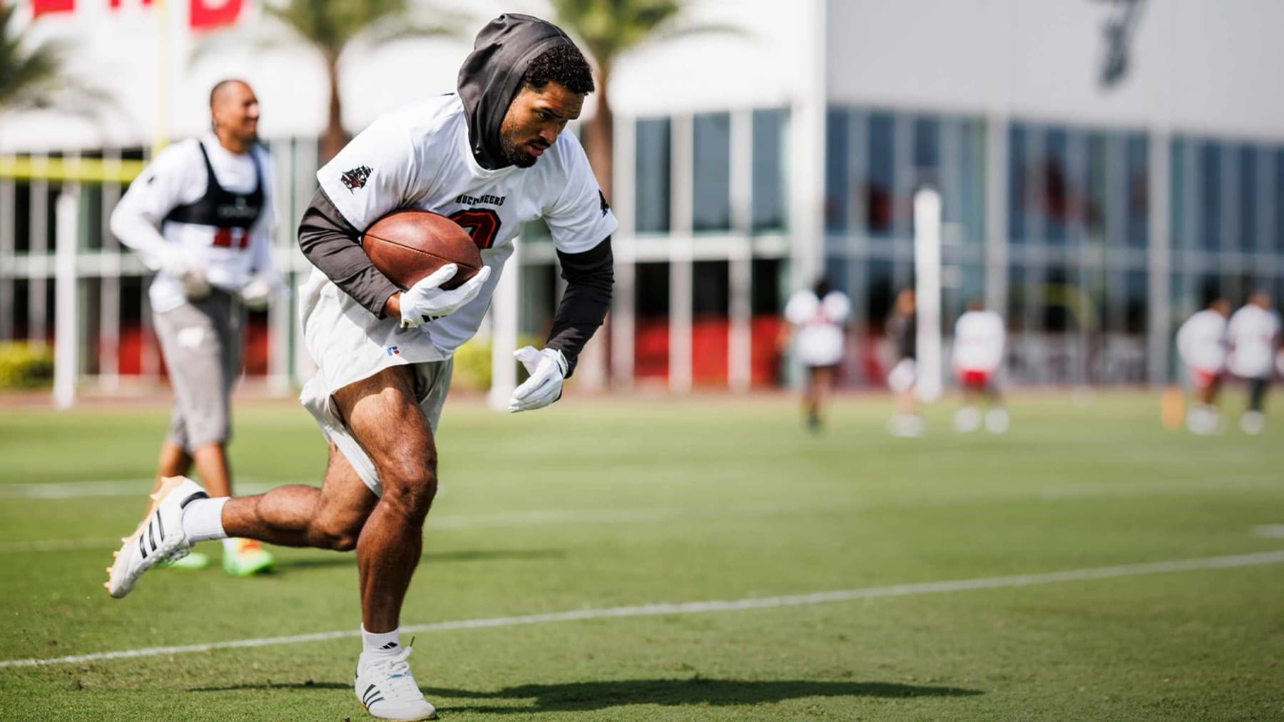 Emeka Egbuka running with the ball at a Tampa Bay Buccaneers practice