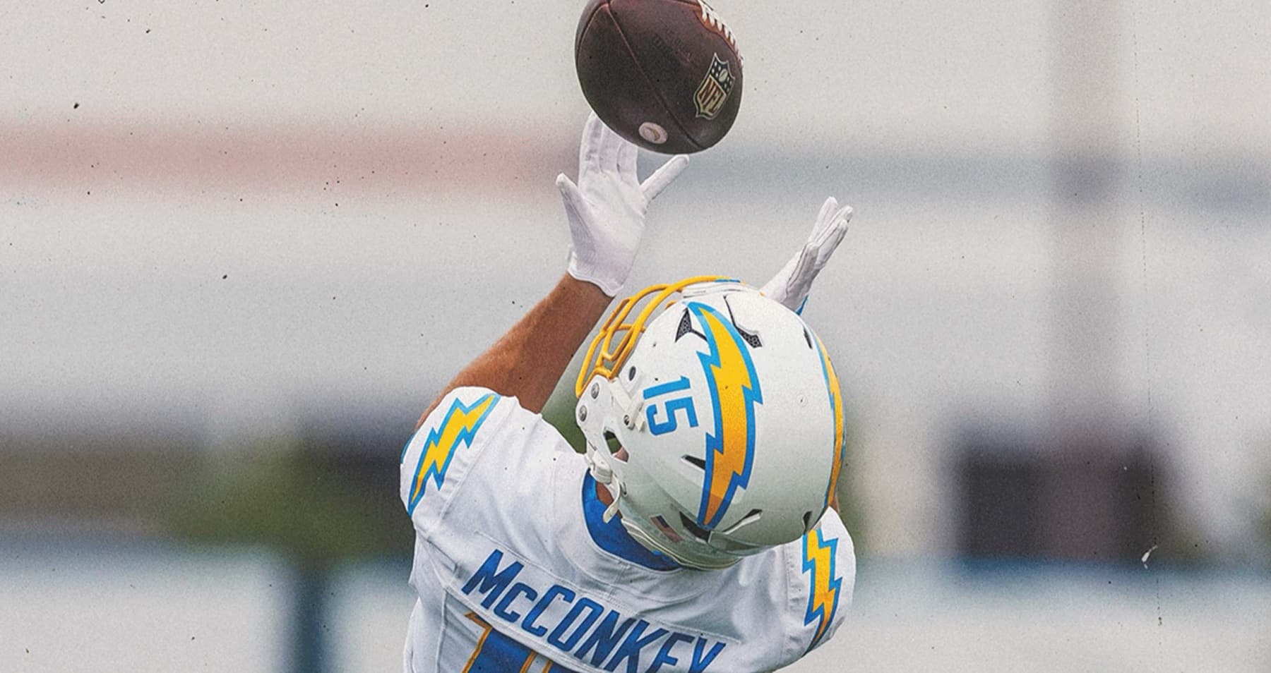 Ladd McConkey reaching for a catch at Los Angeles Chargers training camp