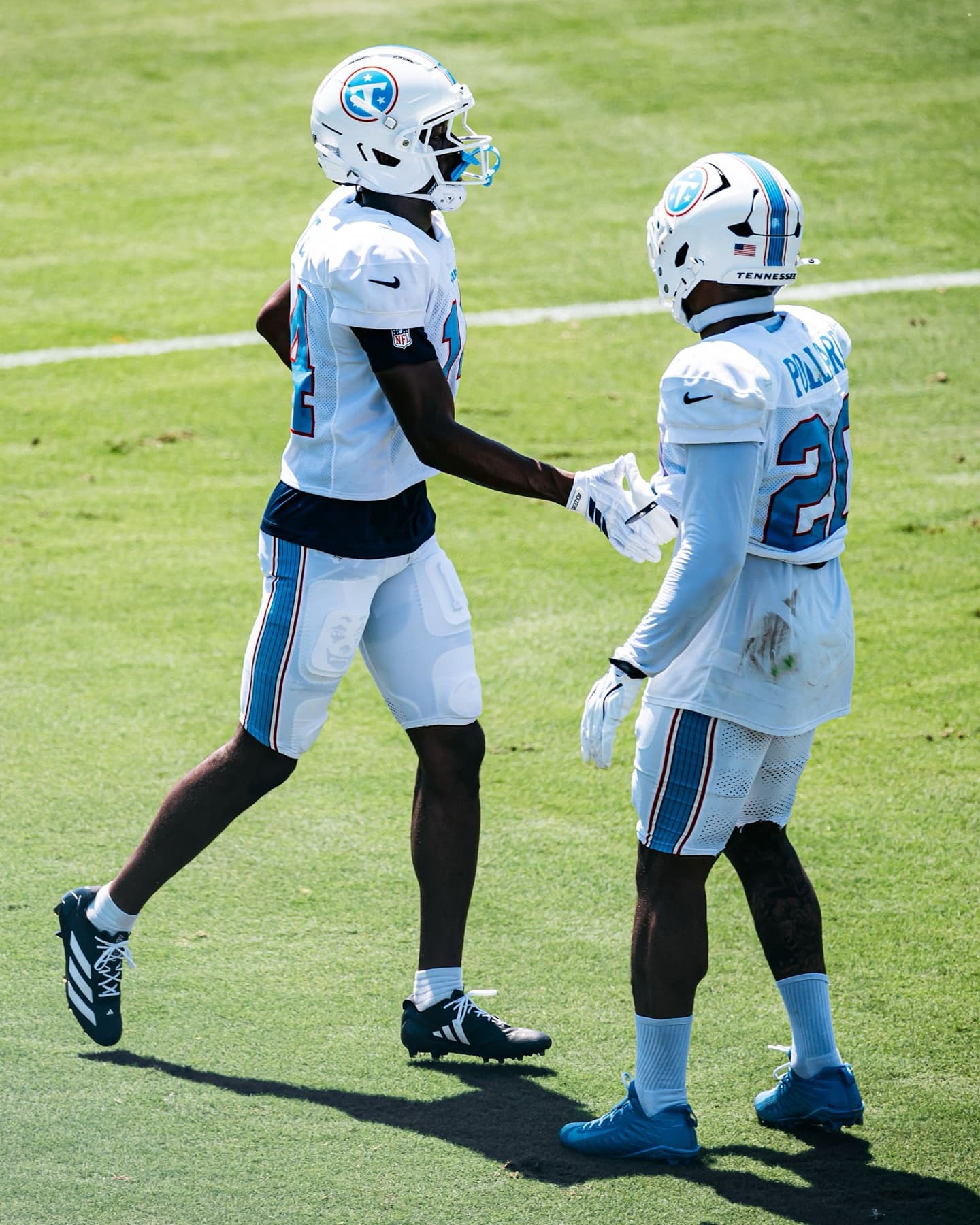Tony Pollard greeting a teammate at Tennessee Titans training camp