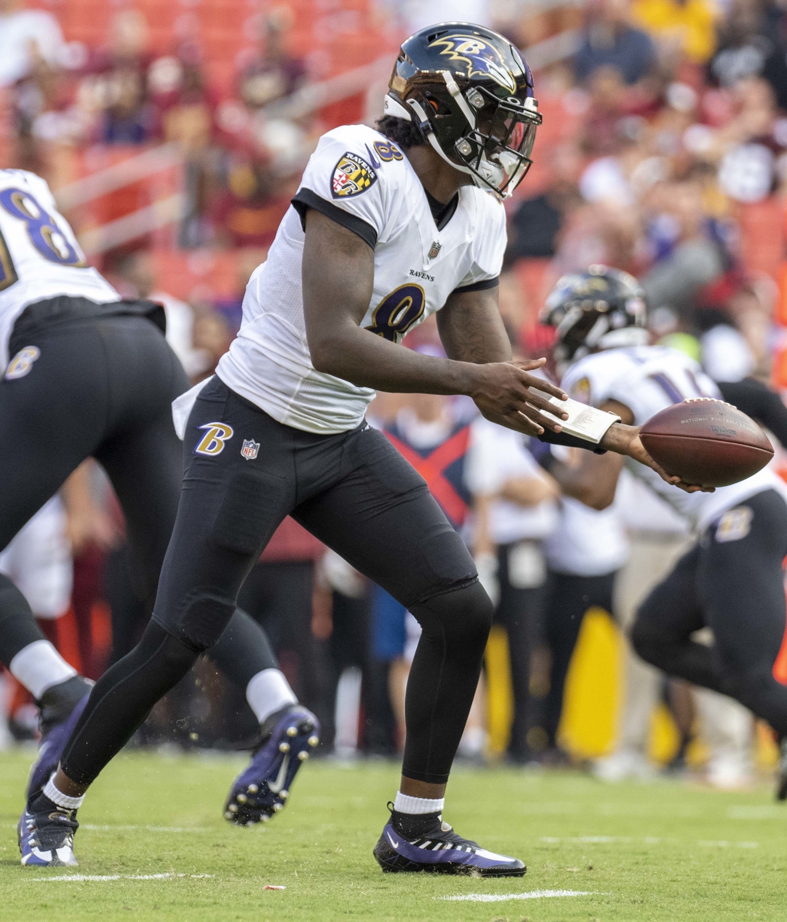 Baltimore Ravens quarterback Lamar Jackson drops back to pass during a preseason game in Washington